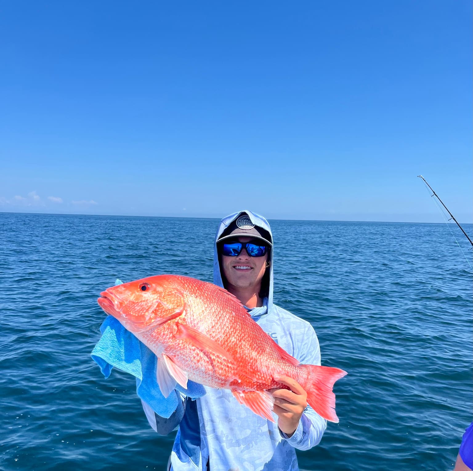 A bright red snapper caught offshore aboard Southern Hook Fishing Charters