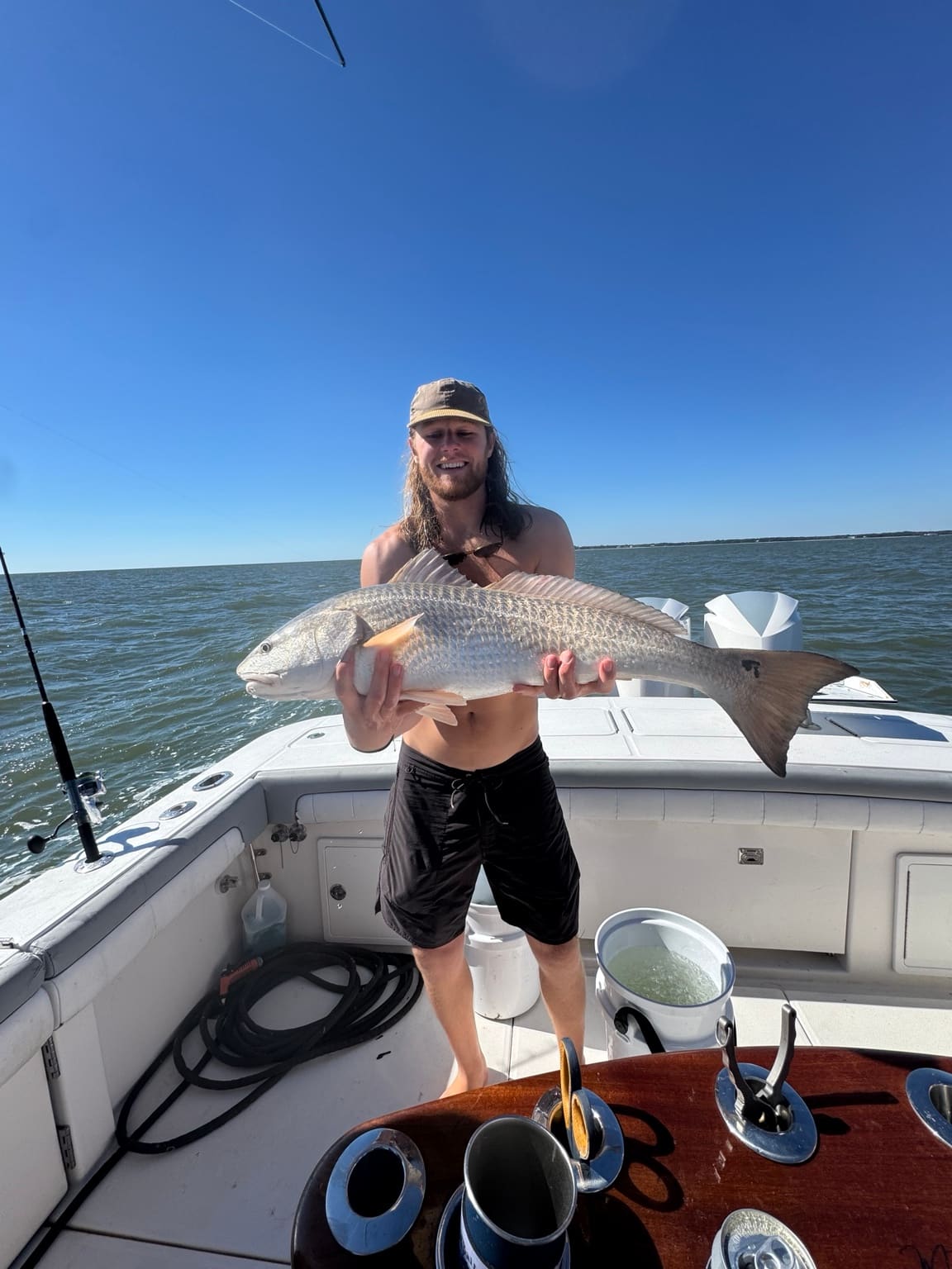 An angler with a redfish caught in the Lowcountry near Hilton Head Island