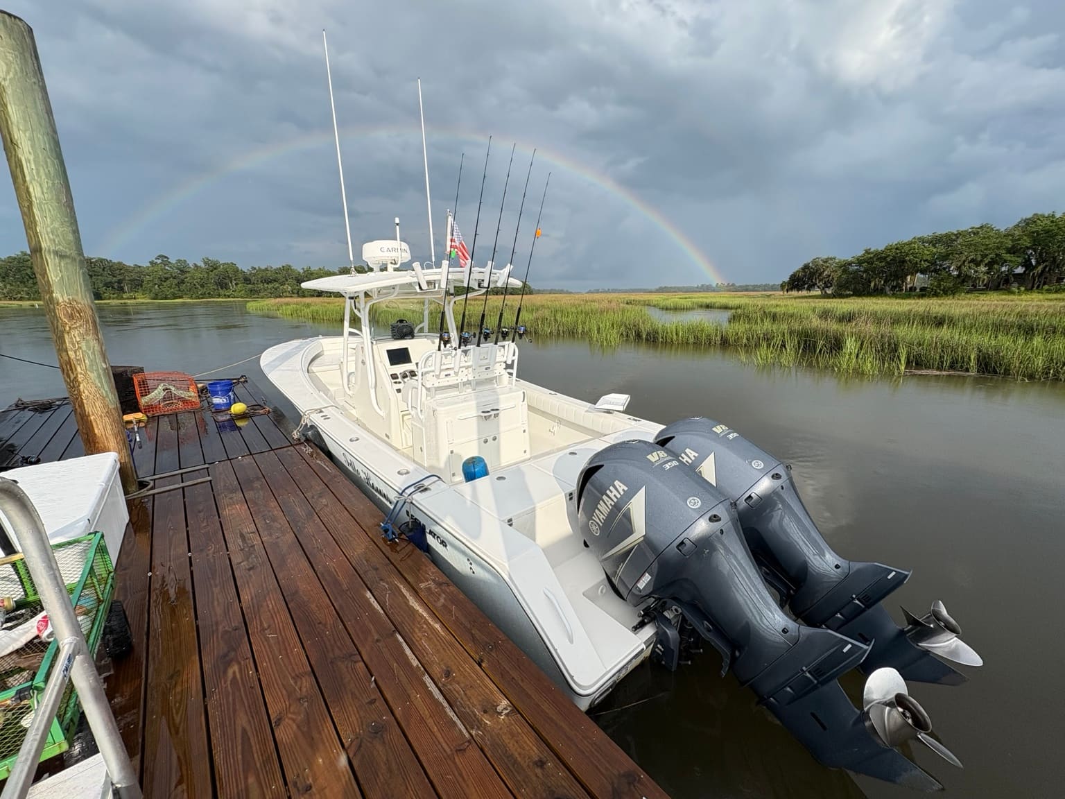 Southern Hook Regulator with twin Yamaha engines at a Lowcountry dock under a rainbow